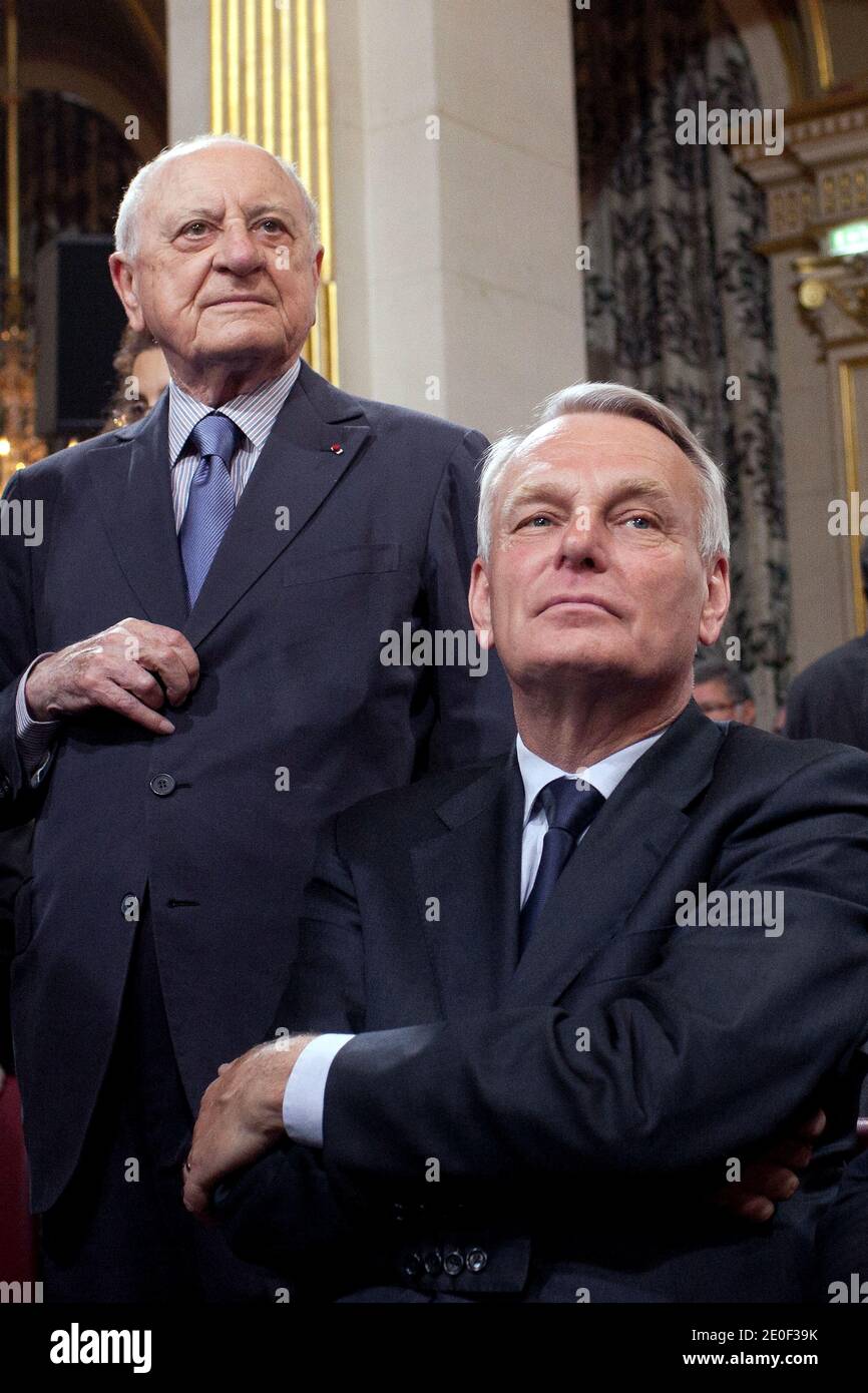 Pierre Berge and Jean-Marc Ayrault are pictured during a traditional  ceremony held at Paris' city