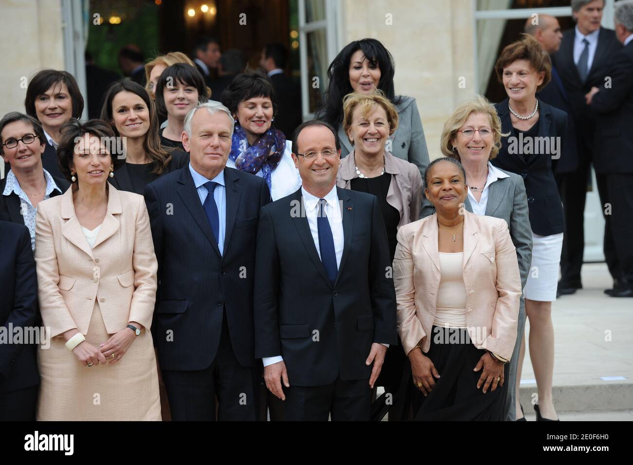 Family picture of the newly appointed women of the French government taken on May 17, 2012 at the Elysee Palace in Paris. (L-Health M, Marisol Touraine; Prime Minister, Jean-Marc Ayrault; French President Francois Hollande; and Justice M, Christiane Taubira. 2nd row - Sports M, Valerie Fourneyron; M for Culture, Aurelie Filippetti; M for State Reform, Marylise Lebranchu; M for Higher Education and Research, Geneviève Fioraso. 3rd row - JM for Disabled People, Marie-Arlette Carlotti; M for Ecology, Nicole Bricq (Hidden); JM for Handicraft, Sylvia Pinel; JM for Family, Dominique Bertinotti; JM f Stock Photo