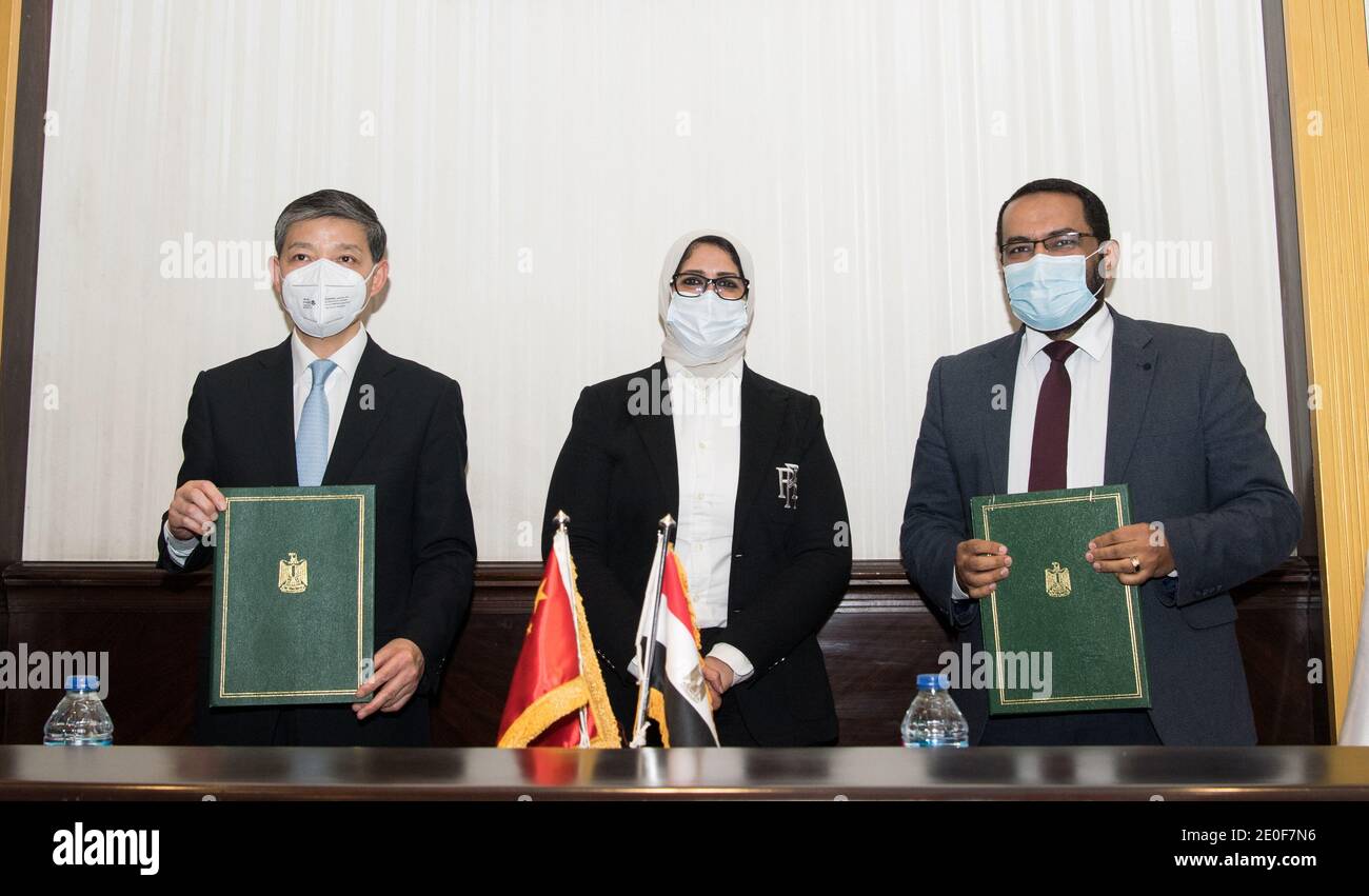 Cairo, Egypt. 31st Dec, 2020. Chinese Ambassador to Egypt Liao Liqiang (L),  Egyptian Health Minister Hala Zayed (C) and Egyptian Assistant Minister of  Health for Public Health Initiatives Mohamed Hassani attend the