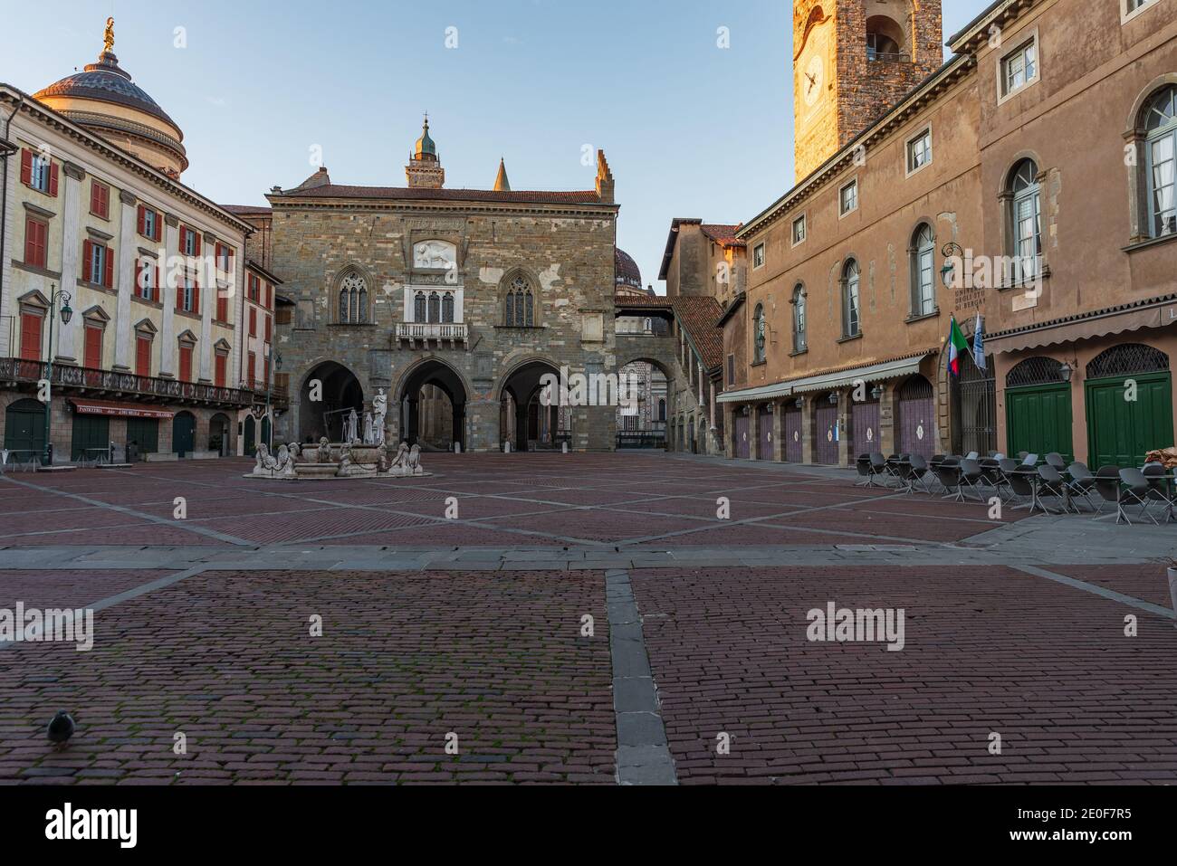 Panorama of Piazza Vecchia with the Contarini Fountain and in the background the Palazzo della Ragione in Piazza Vecchia in Bergamo Alta, Italy Stock Photo