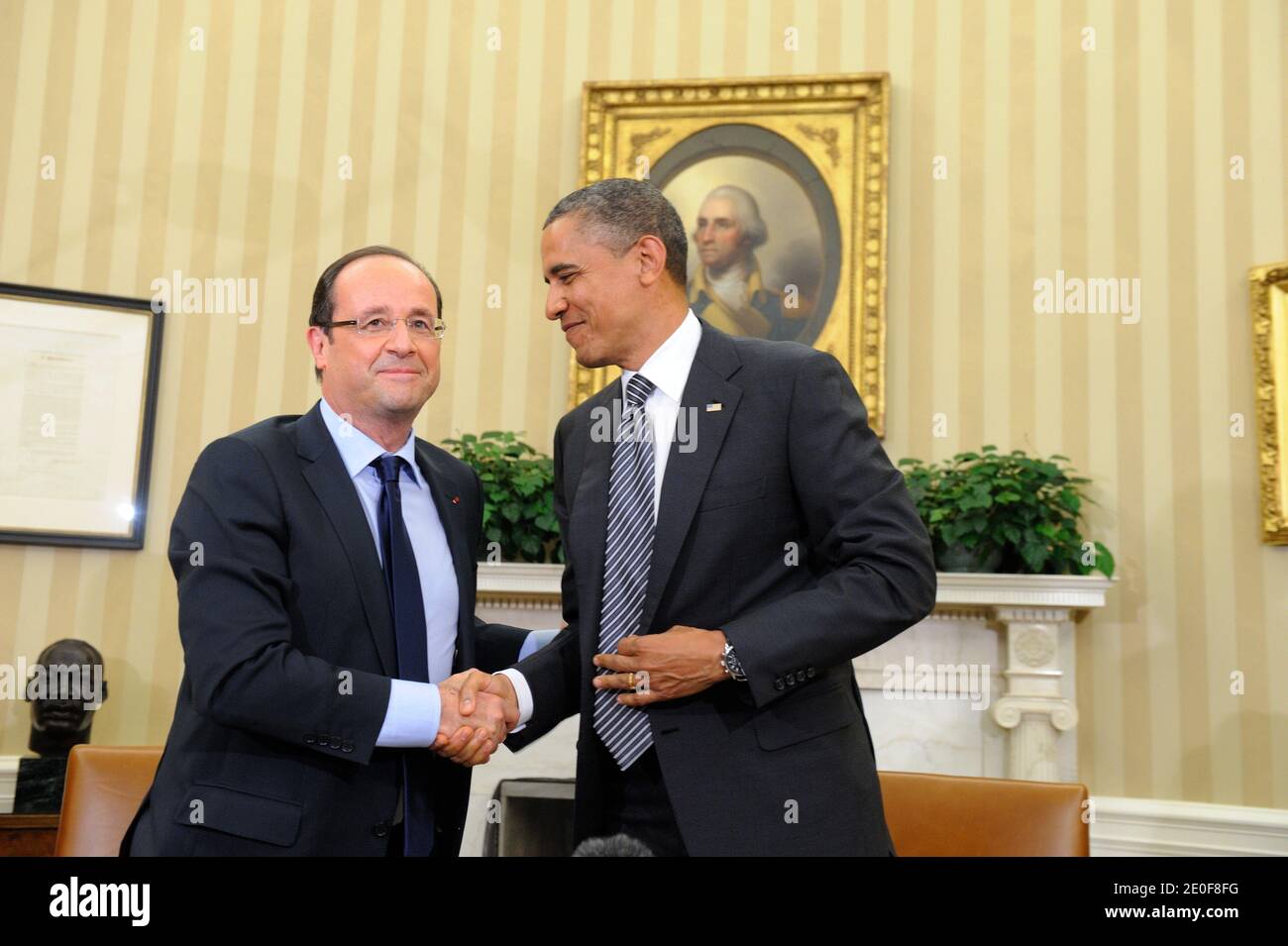 US President Barack Obama holds a bilateral meeting with French President Francois Hollande in advance of the G-8 and NATO Summits in the Oval Office of the White House in Washington, DC, USA on May 18, 2012. The two Presidents discussed their cooperation on a range of key topics, to include the global economy and Afghanistan. Photo by Jacques Witt/Pool/ABACAPRESS.COM Stock Photo