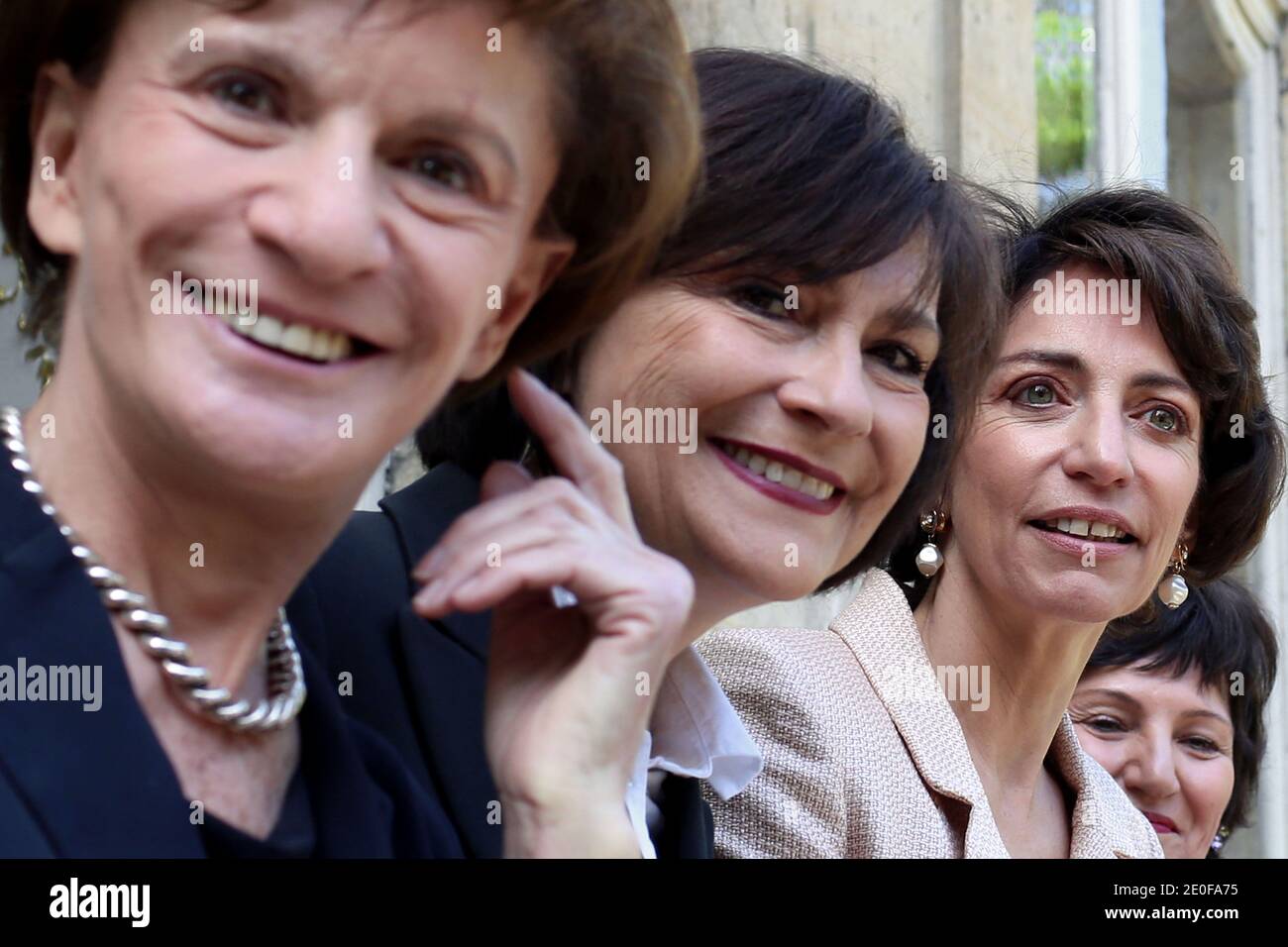 French newly appointed Social Affairs and Health Minister Marisol Touraine flanked Junior Minister for Disabled People Marie-Arlette Carlotti (L), newly appointed French Junior Minister for the Elderly and Disabled Michele Delaunay and French Junior Minister for Family Dominique Bertinotti (R), addresses journalists upon her arrival at the Health Ministry in Paris to attend the official handover ceremony with her predecessor Xavier Bertrand, in Paris, France on May 17, 2012. Photo by Stephane Lemouton/ABACAPRESS.COM. Stock Photo