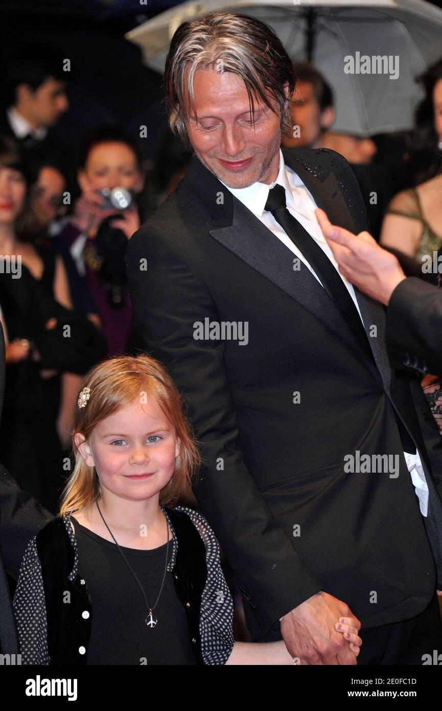 Viola Jacobsen and Mads Mikkelsen posing before the premiere of 'Jagten' ('The Hunt') presented