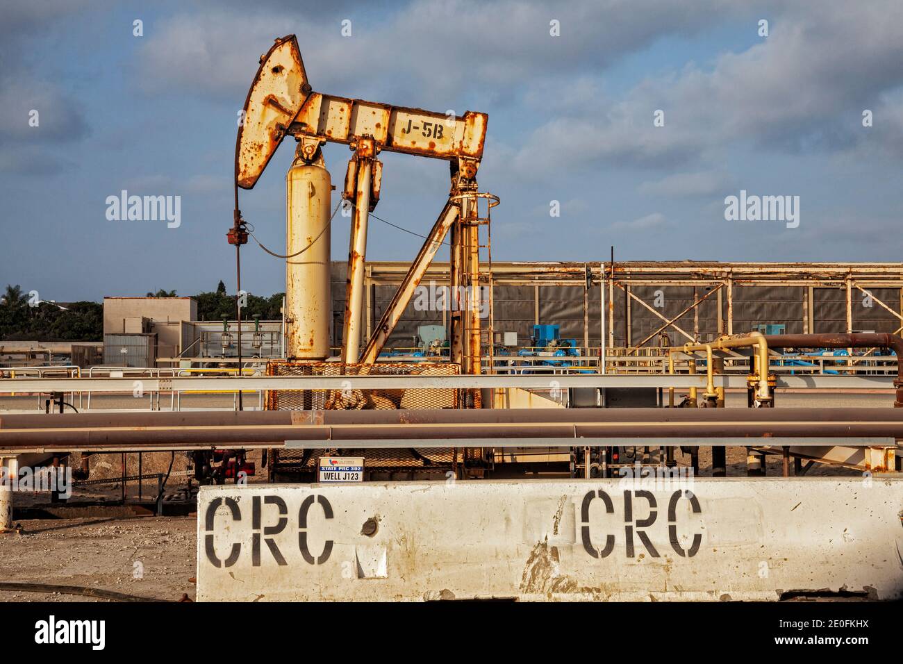 Old oil wells and pumpjacks at CRC (California Resources Corporation) facility in Huntington Beach. CRC has filed for bankruptcy and there are questio Stock Photo