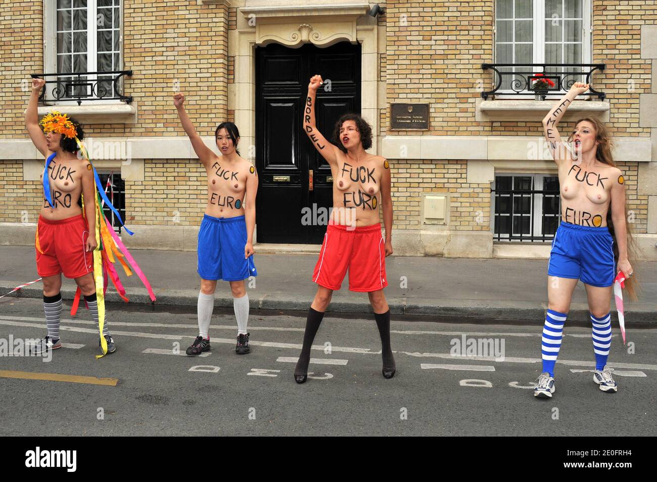 French members of Ukrainian feminist group Femen protest against  prostitution during the Euro 2012 football championships, outside the  Embassy of Ukraine in Paris, France on June 1, 2012. The protest was  organised