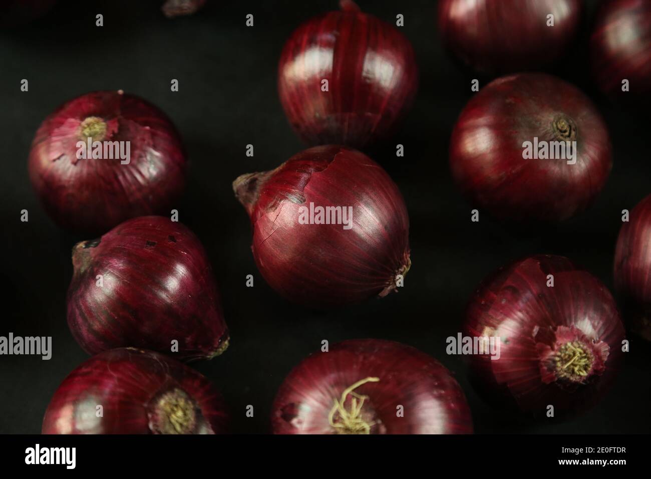 sweet red onions on background Stock Photo - Alamy