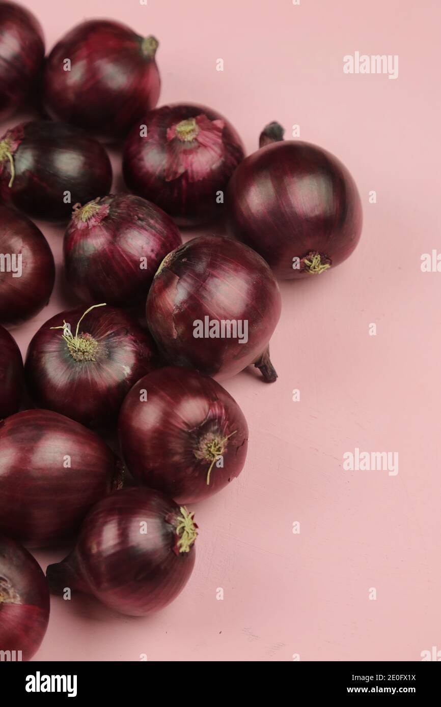 sweet red onions on background Stock Photo