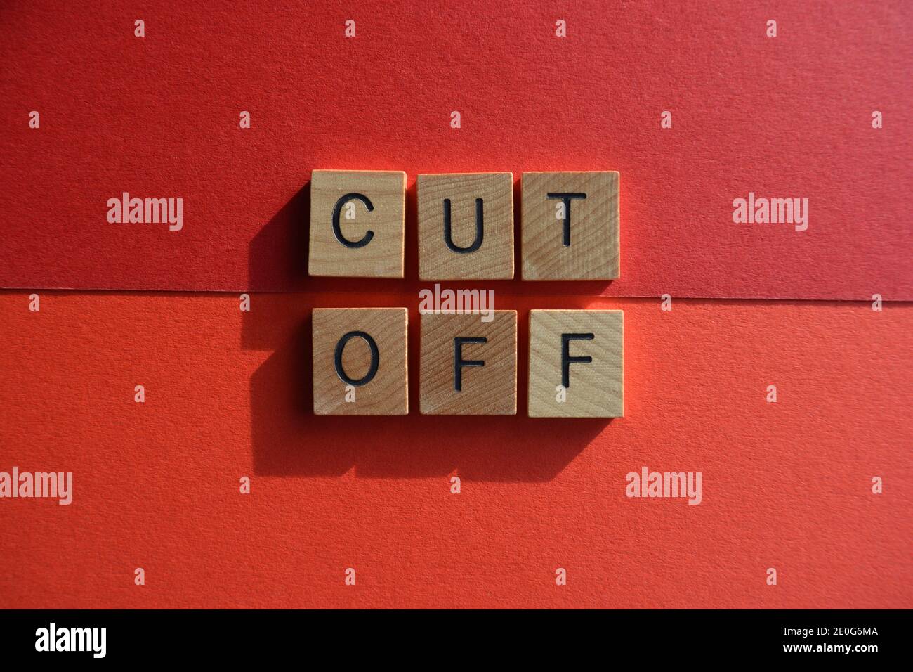 cut-off-words-in-wooden-alphabet-letters-isolated-on-red-background
