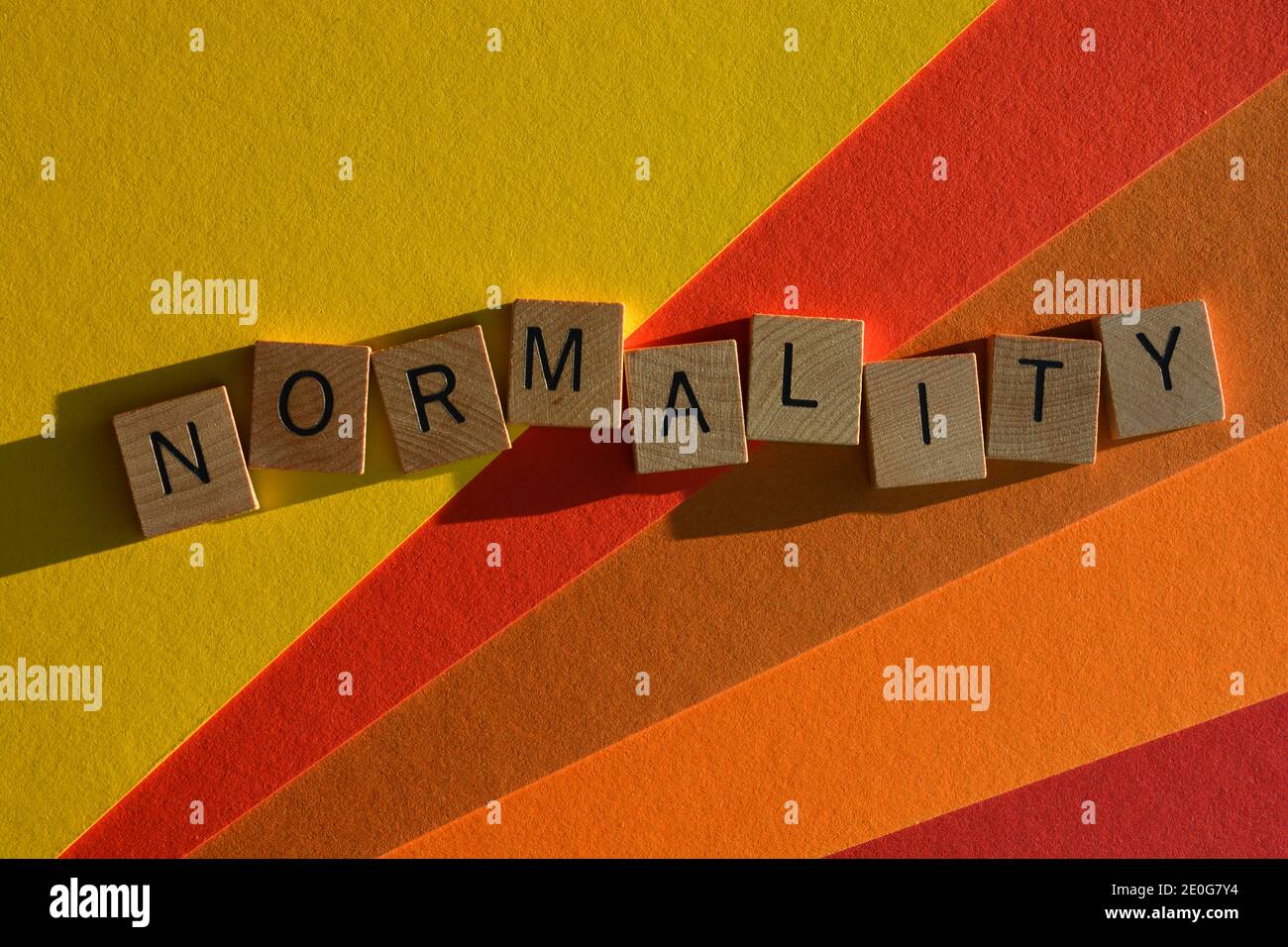Normality, word in wooden alphabet letters on colorful background Stock Photo
