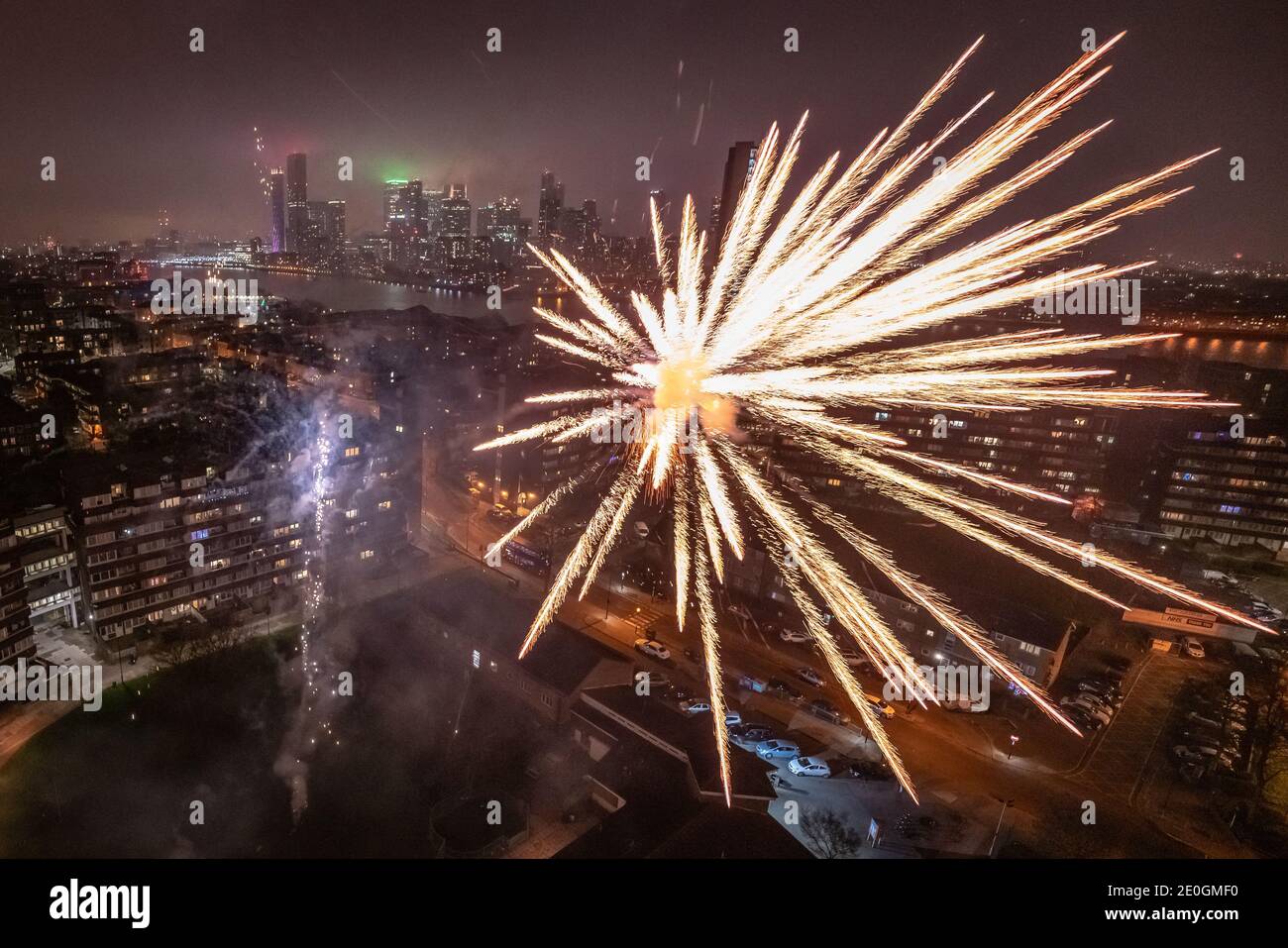 New Year's Eve: Spectacular local fireworks over east London housing estate, UK. Stock Photo