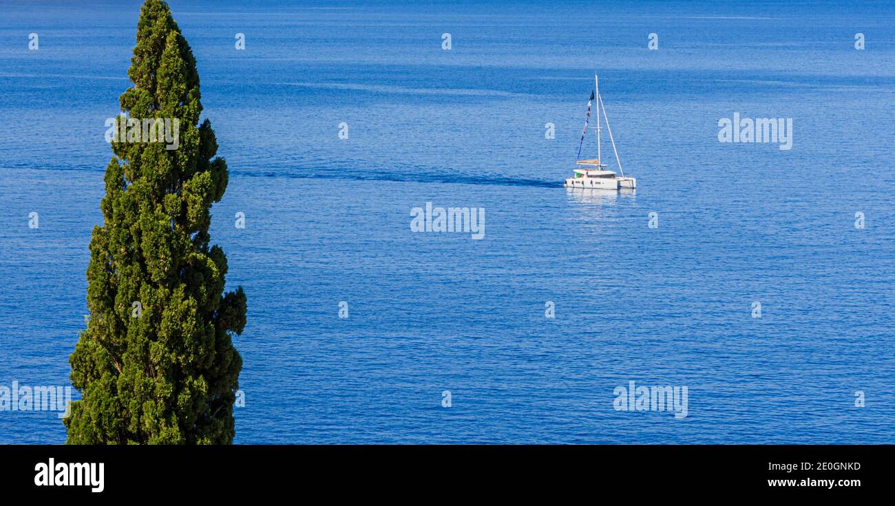 Catamaran on the Aegean Sea close to the island of Symi, Dodecanese, Greece Stock Photo