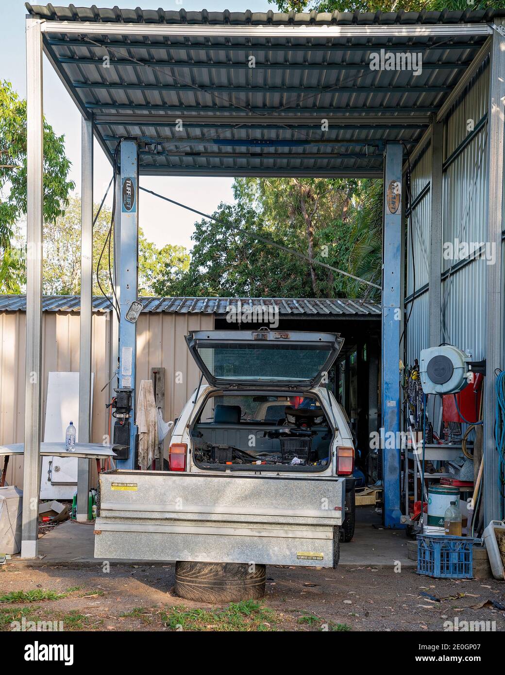 Townsville, Queensland, Australia - December 2020: An old station wagon car parked in a shed and under repair Stock Photo