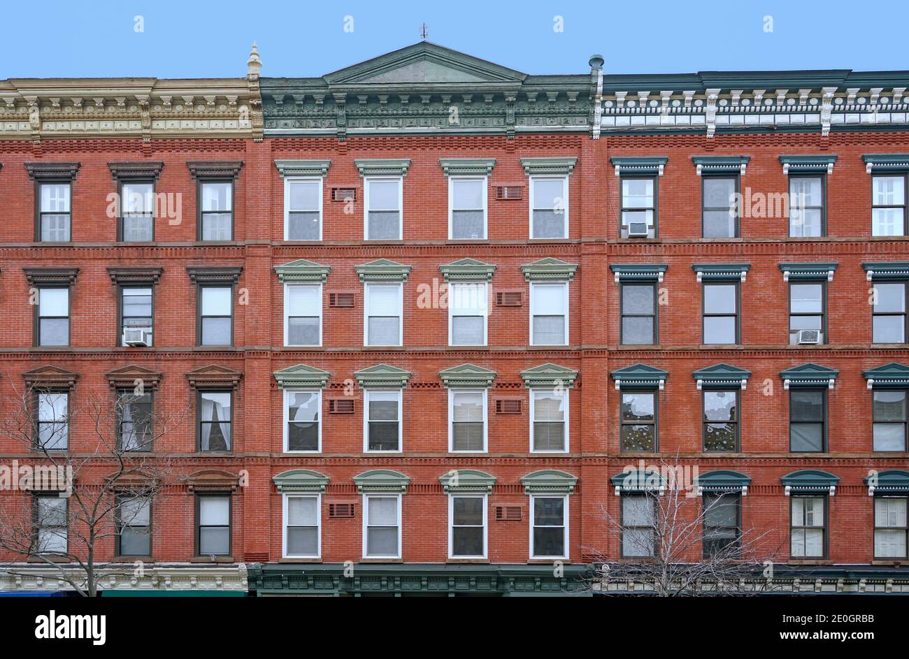 old fashioned apartment building facade with ornate roofline decorations Stock Photo