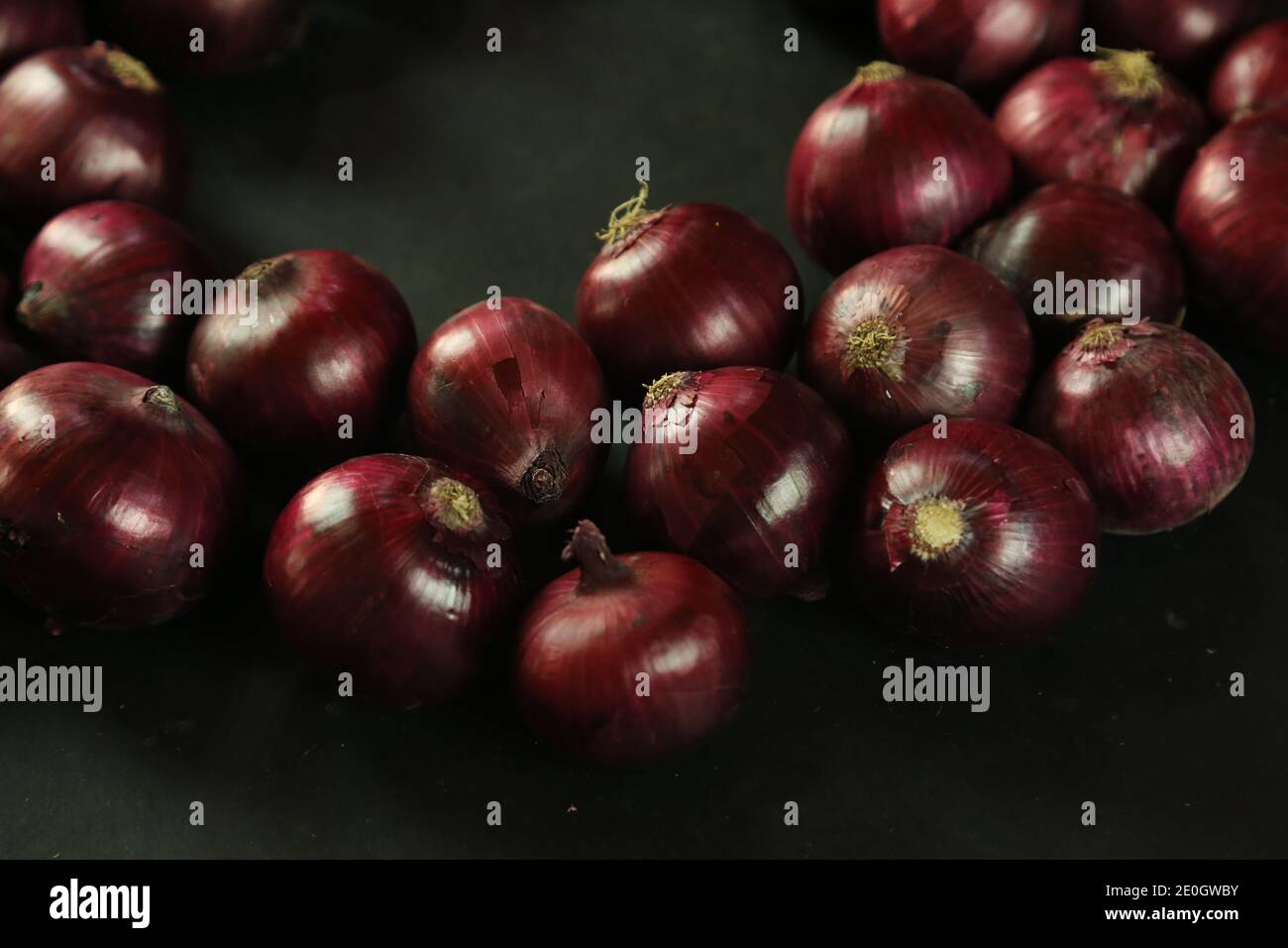 sweet red onions on background Stock Photo