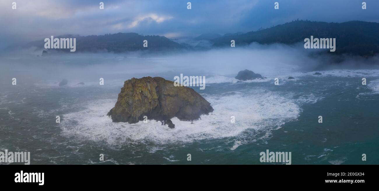 The marine layer drifts over the coastline of Northern California in Klamath. This region is home to the world's most beautiful temperate forests. Stock Photo