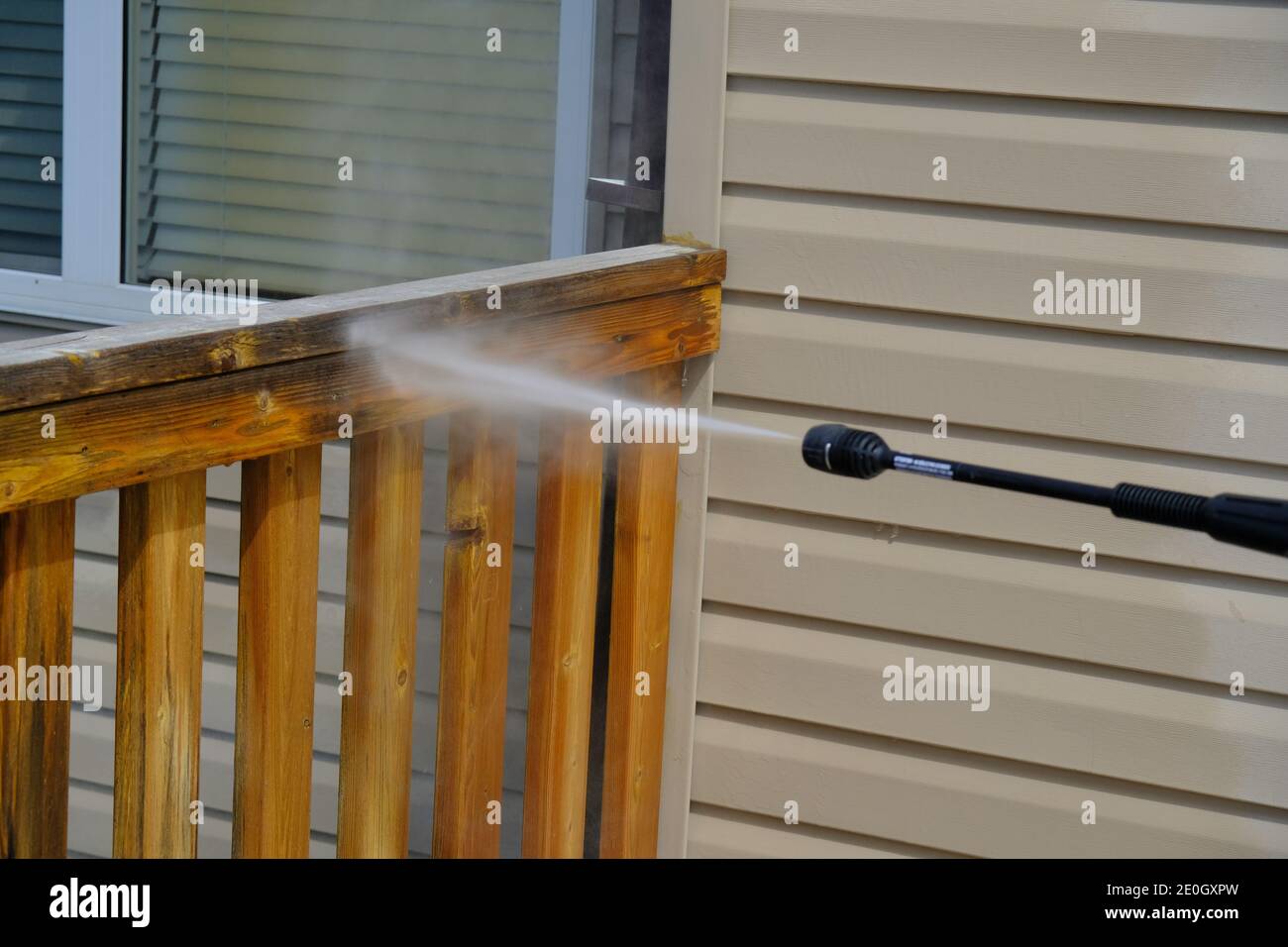 Cleaning House Deck in summer with pressure hose Stock Photo Alamy