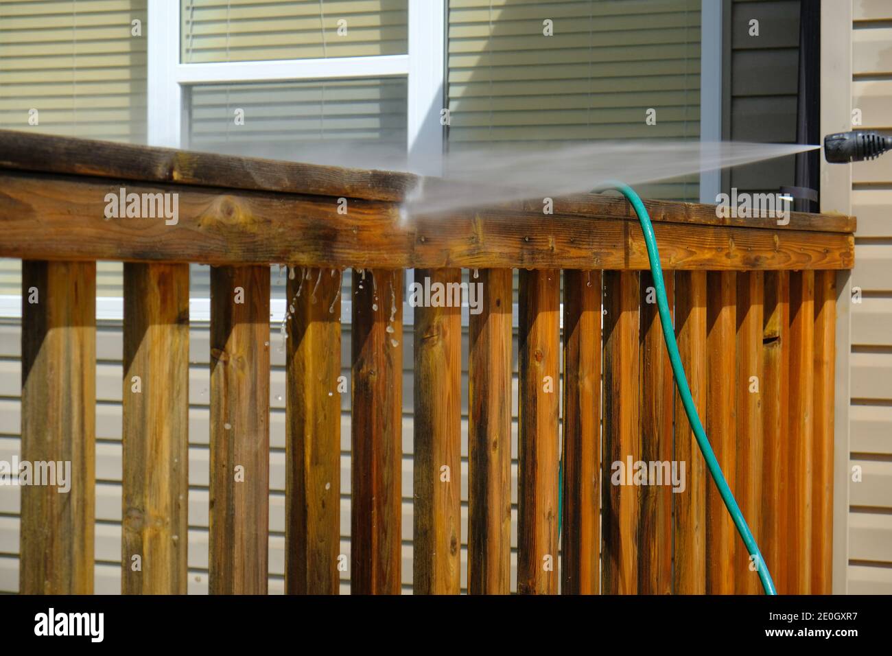 Cleaning House Deck in summer with pressure hose Stock Photo Alamy
