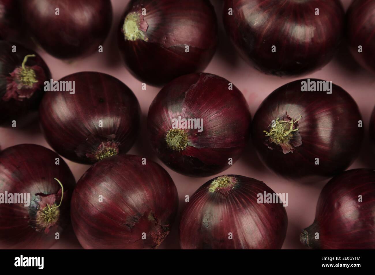 sweet red onions on background Stock Photo