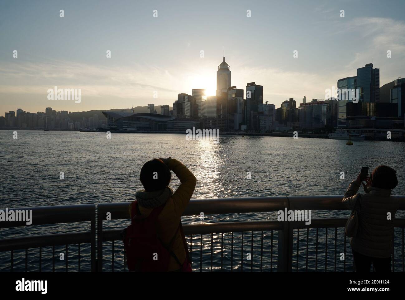 Hong Kong, China. 1st Jan, 2021. People watch the sunrise at the Victoria Harbor in Hong Kong, south China, Jan. 1, 2021. Credit: Li Gang/Xinhua/Alamy Live News Stock Photo