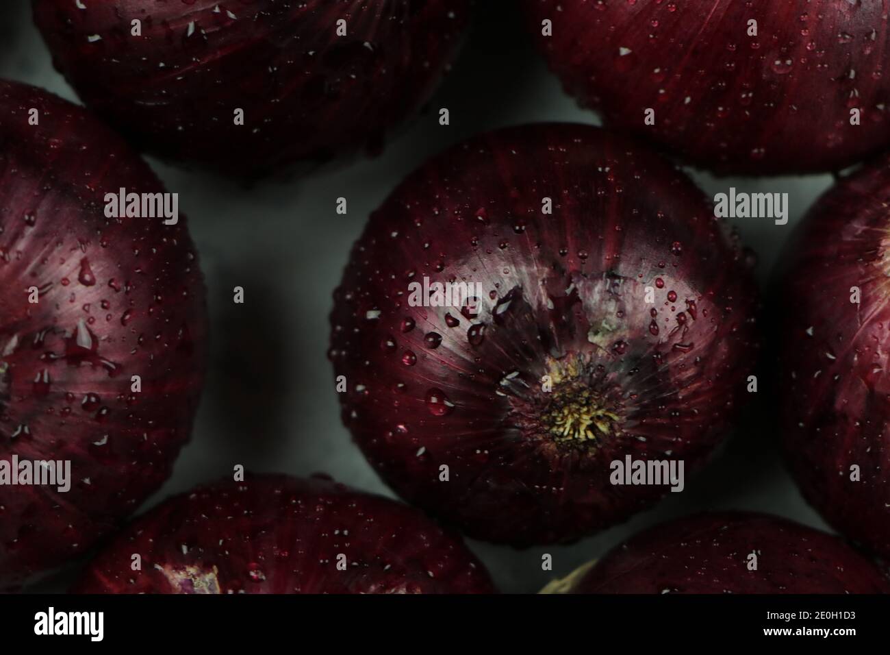 sweet red onions on background Stock Photo