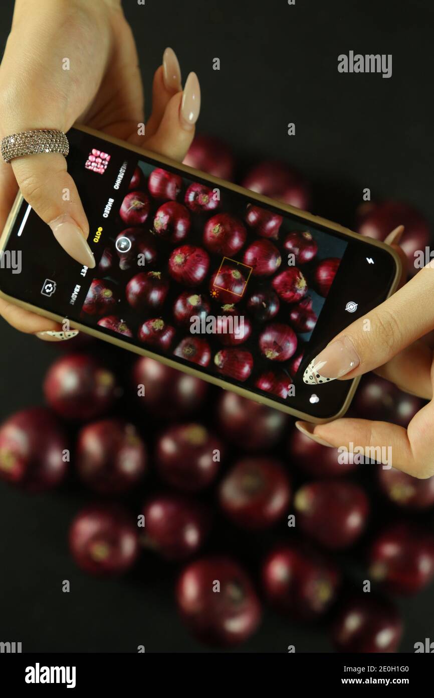 sweet red onions on background Stock Photo