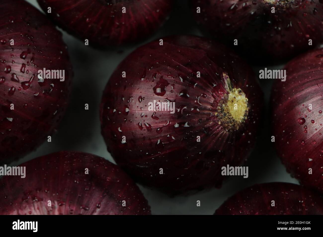 sweet red onions on background Stock Photo
