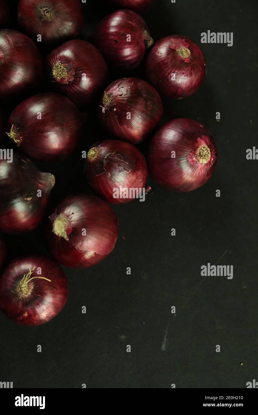 sweet red onions on background Stock Photo