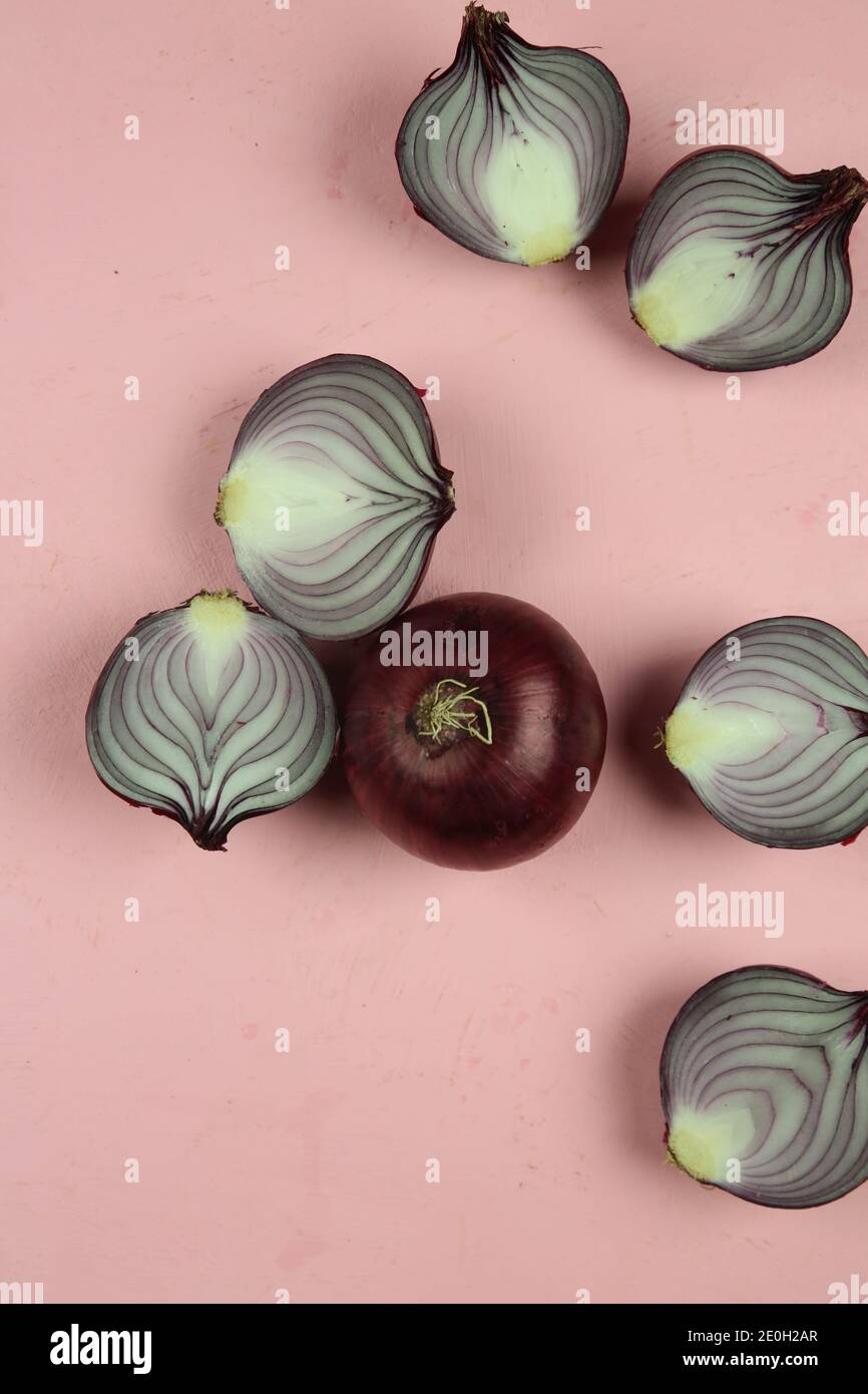 sweet red onions on background Stock Photo