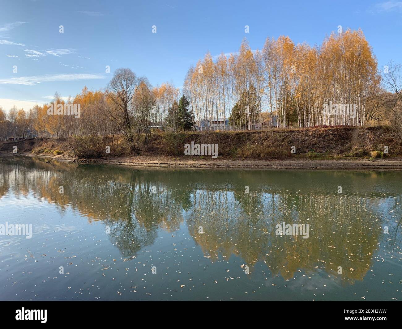Lake in a forest in early autumn Stock Photo - Alamy