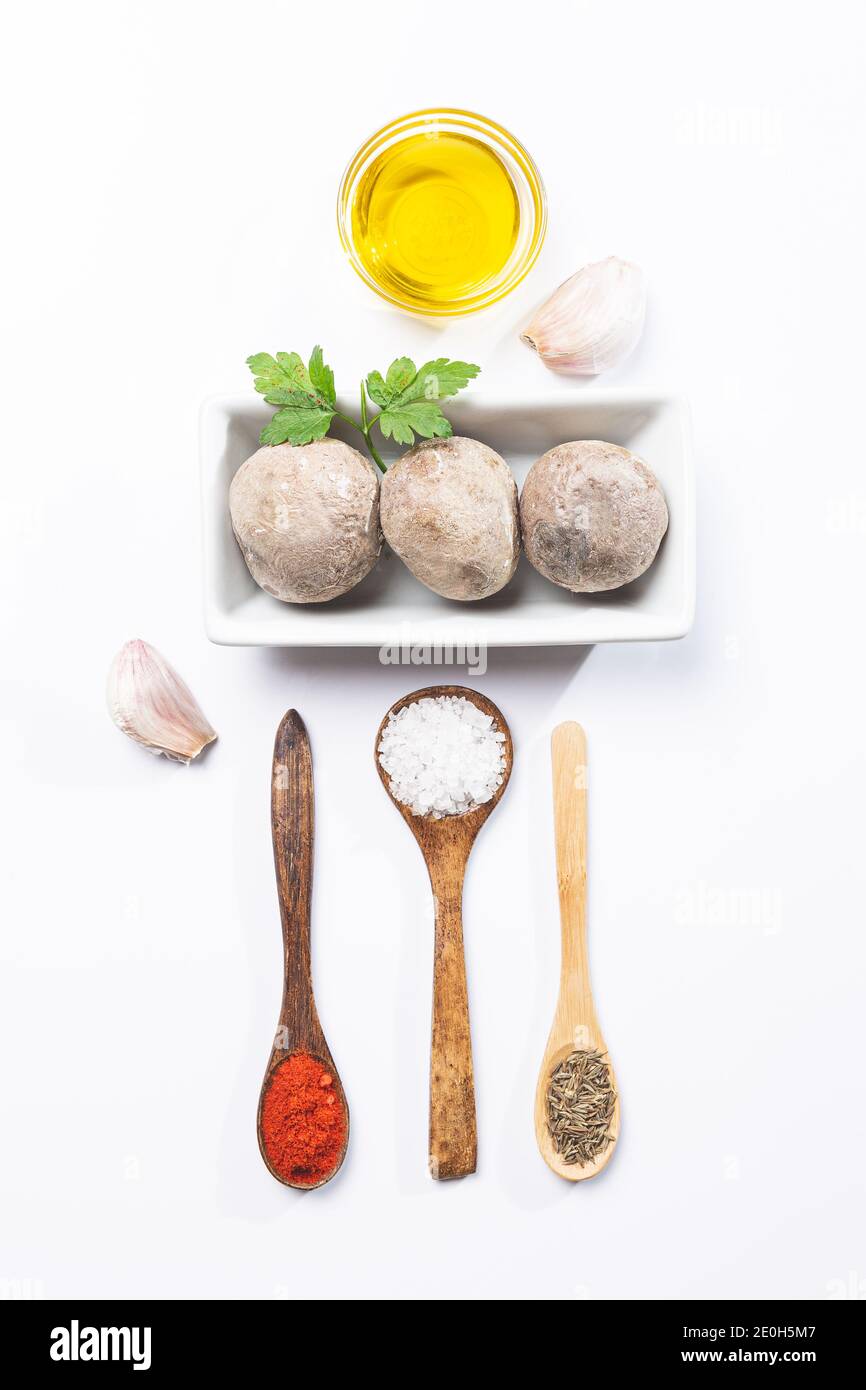 Papas arrugadas con mojo . Typical canarian dish, potatoes with mojo picón. Typical Spanish and Canarian tapas concept . Stock Photo