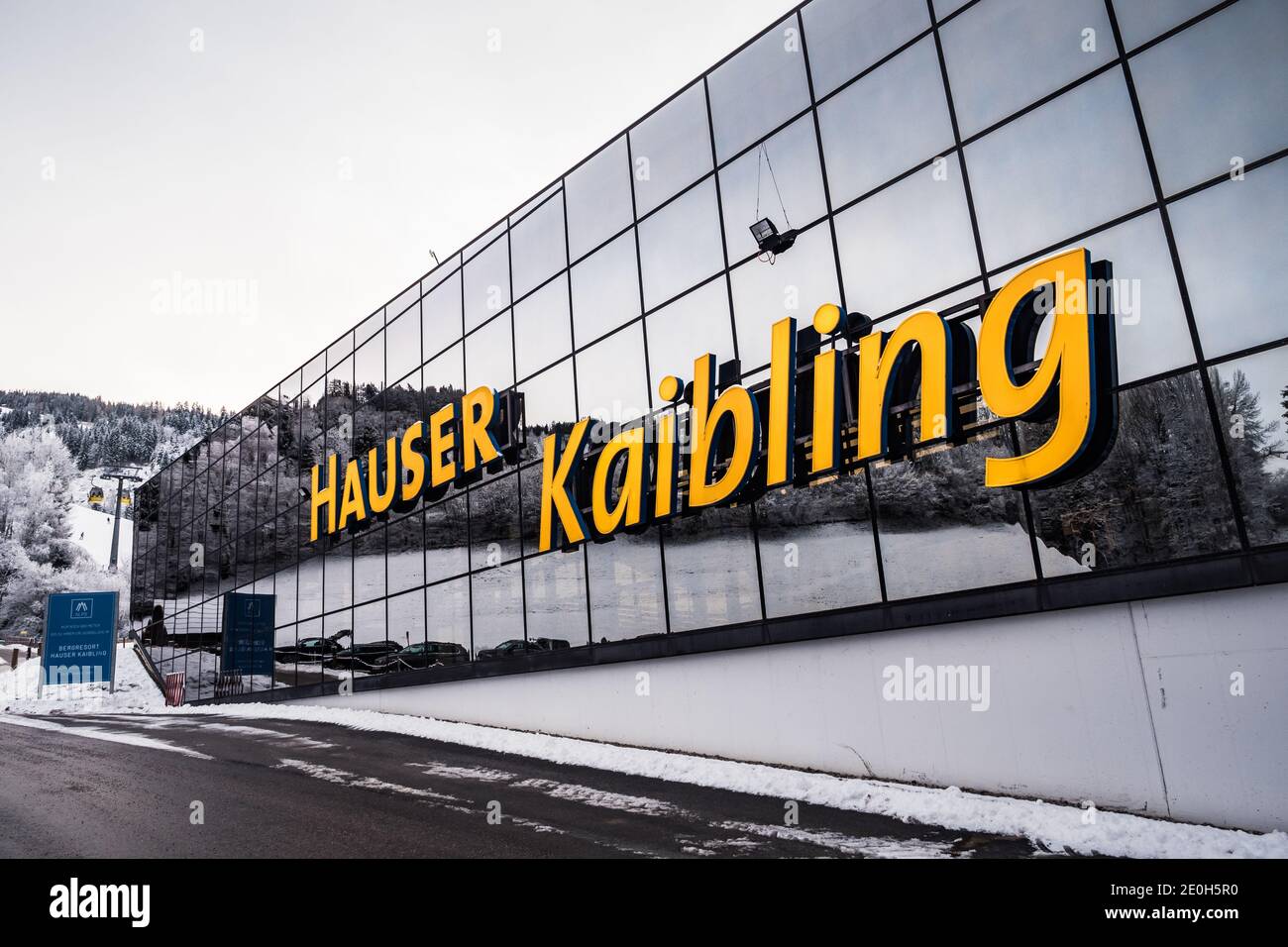 Haus im Ennstal, Austria - December 29 2020: Hauser Kaibling Gondola Lift Station Building Facade with Sign in Winter. Stock Photo