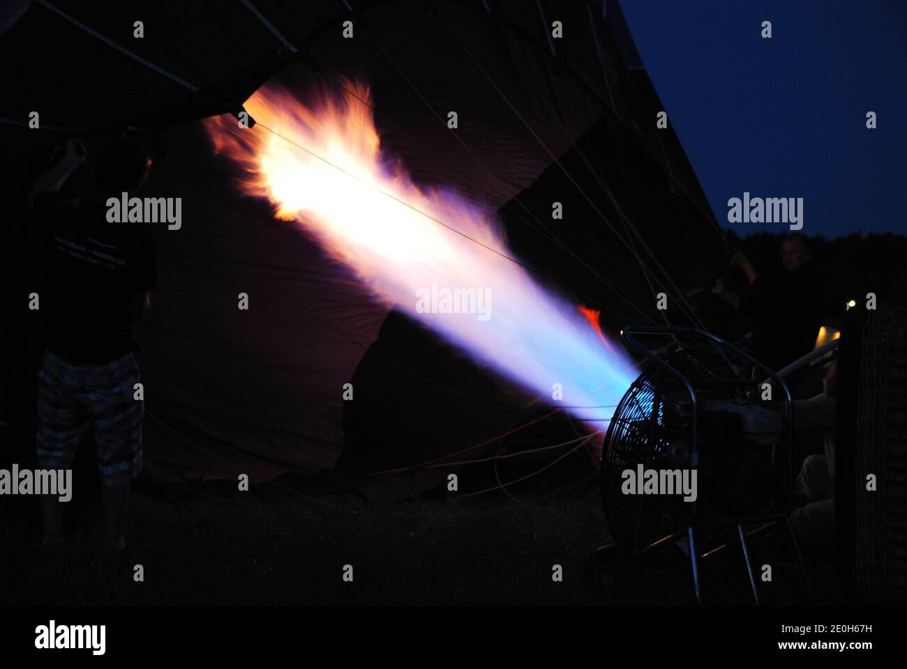 bright hot firing during inflate one balloon Stock Photo