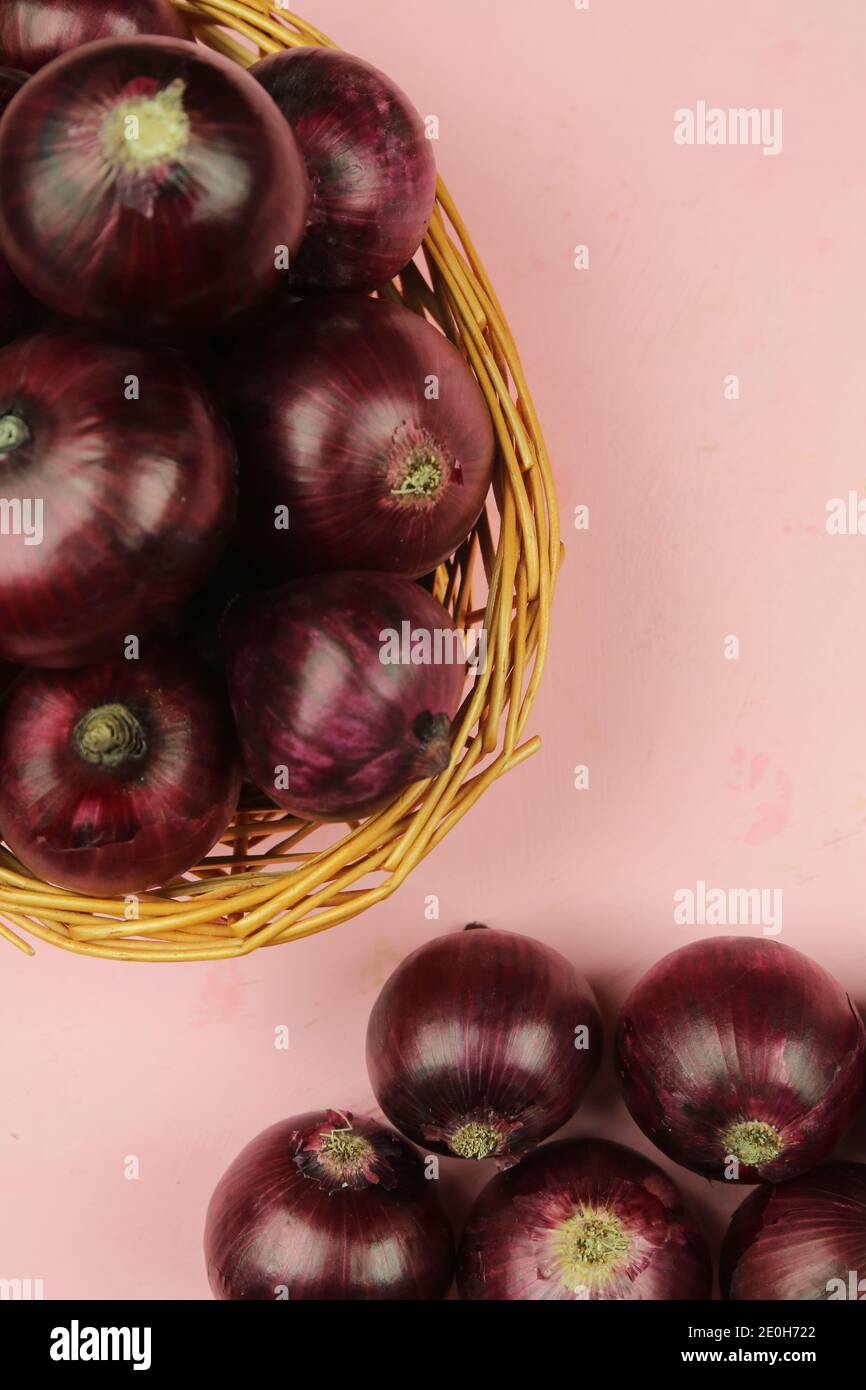sweet red onions on background Stock Photo