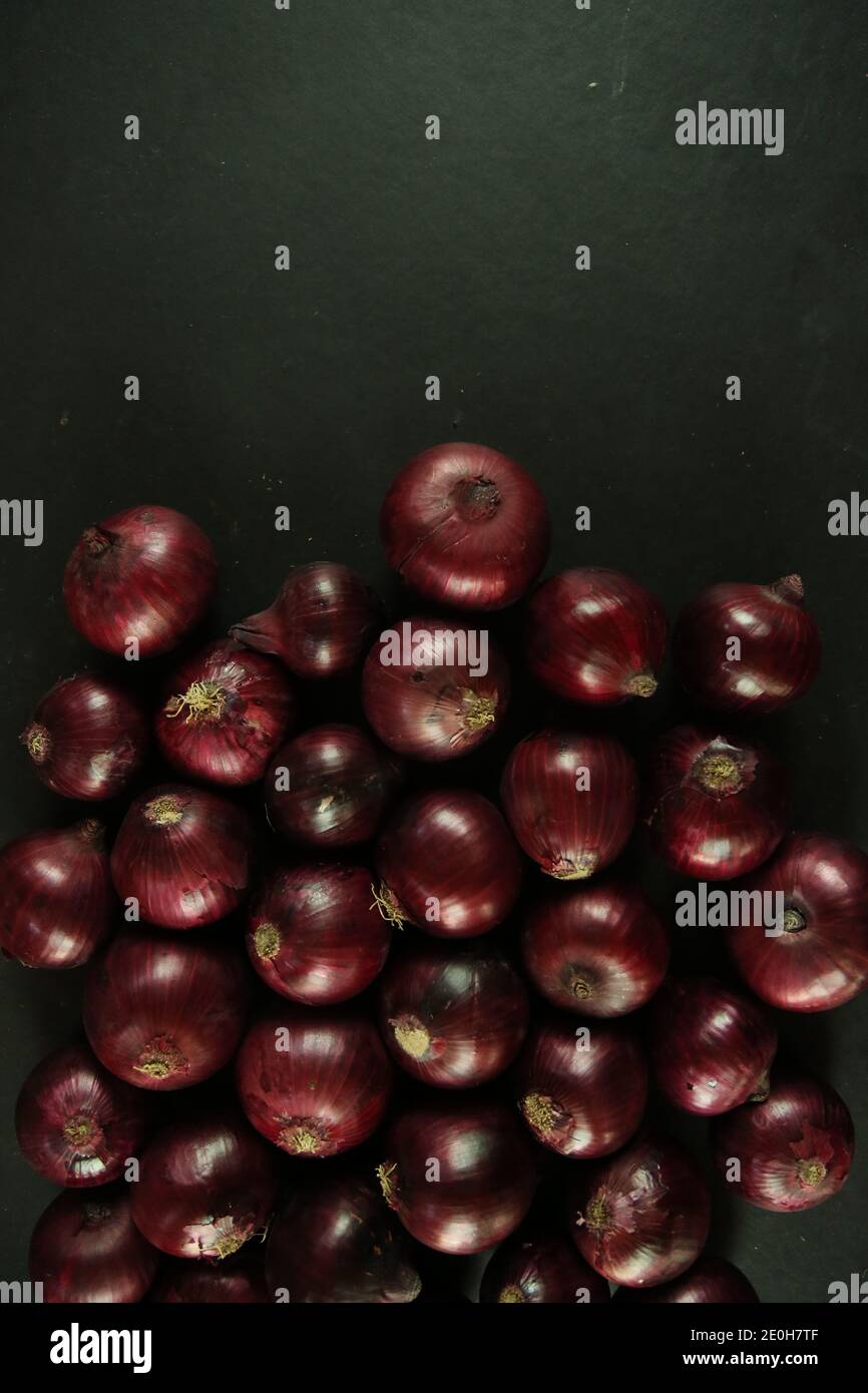 sweet red onions on background Stock Photo