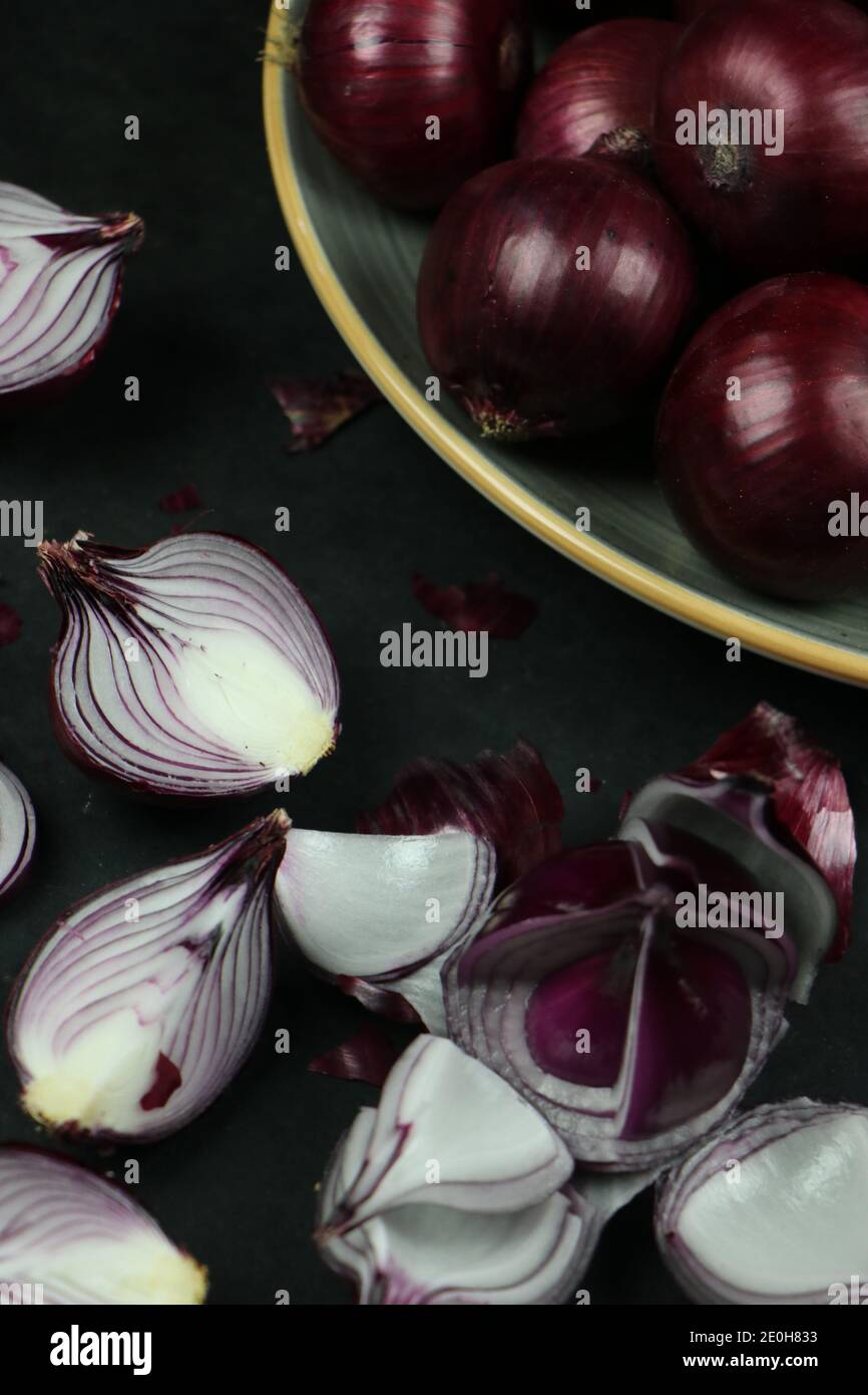 sweet red onions on background Stock Photo