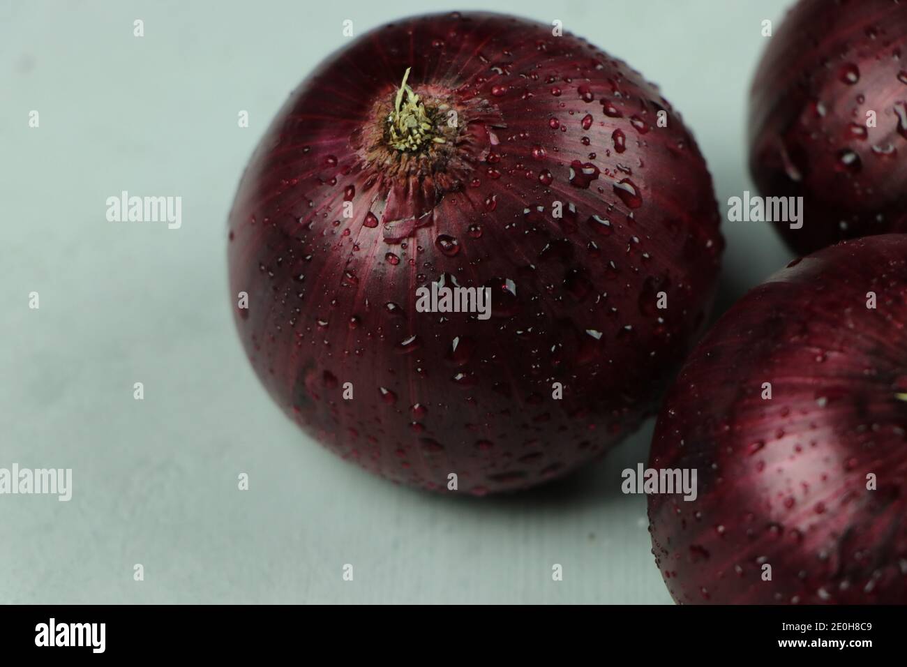 sweet red onions on background Stock Photo