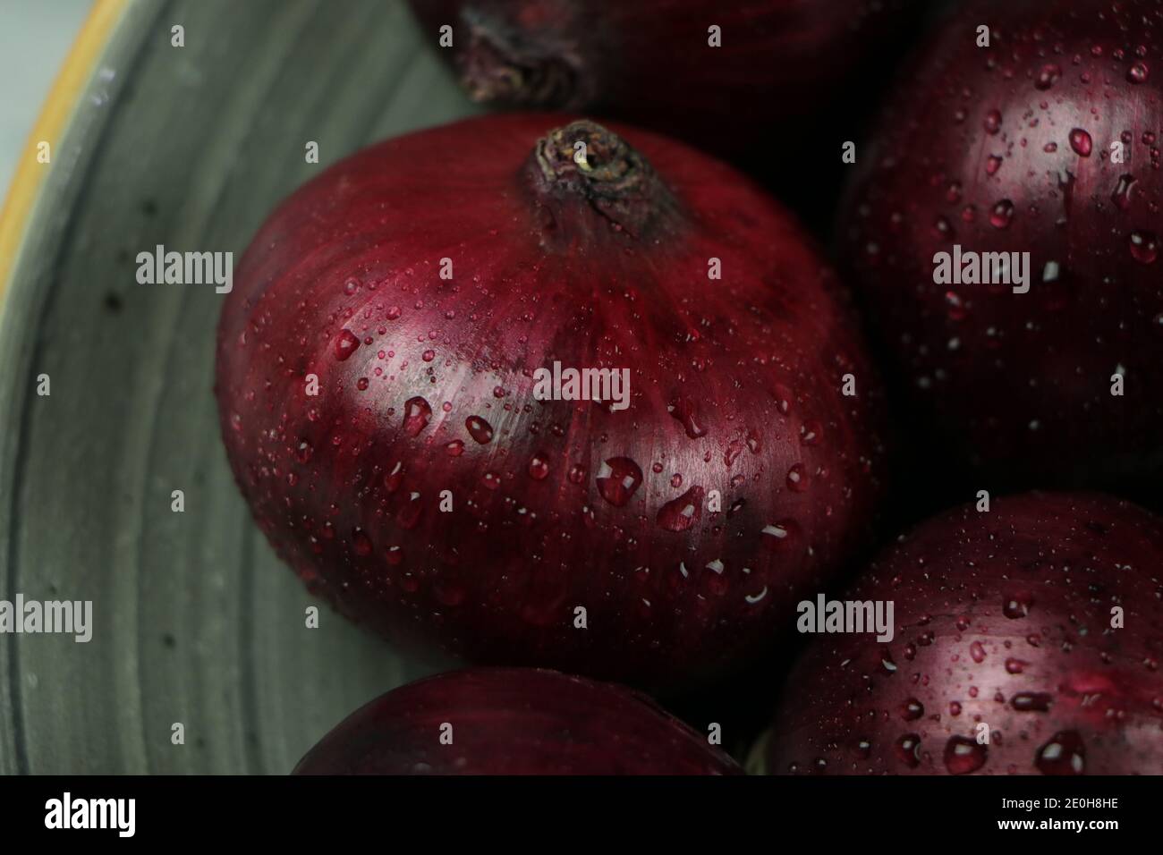 sweet red onions on background Stock Photo