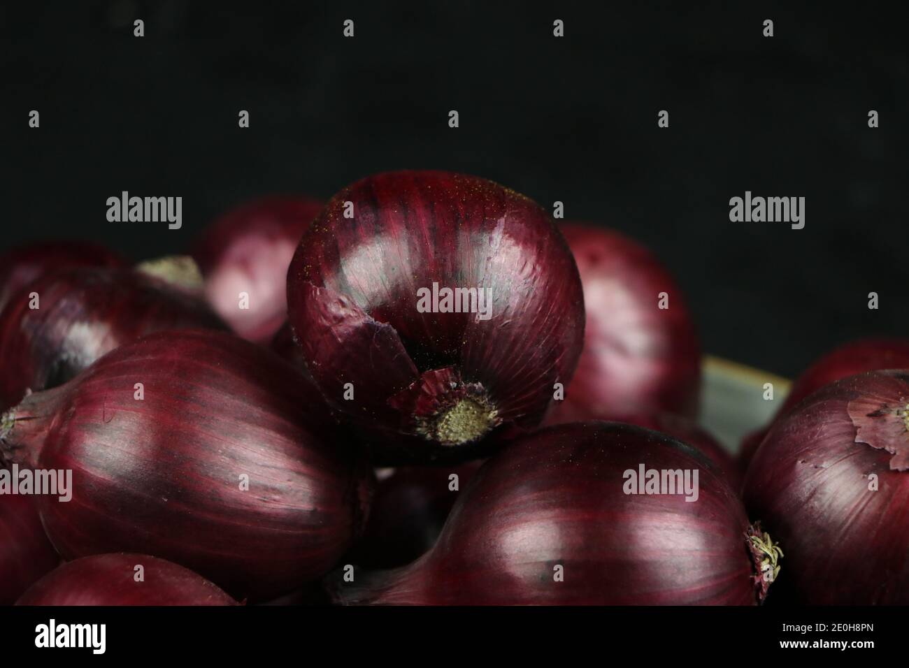 sweet red onions on background Stock Photo