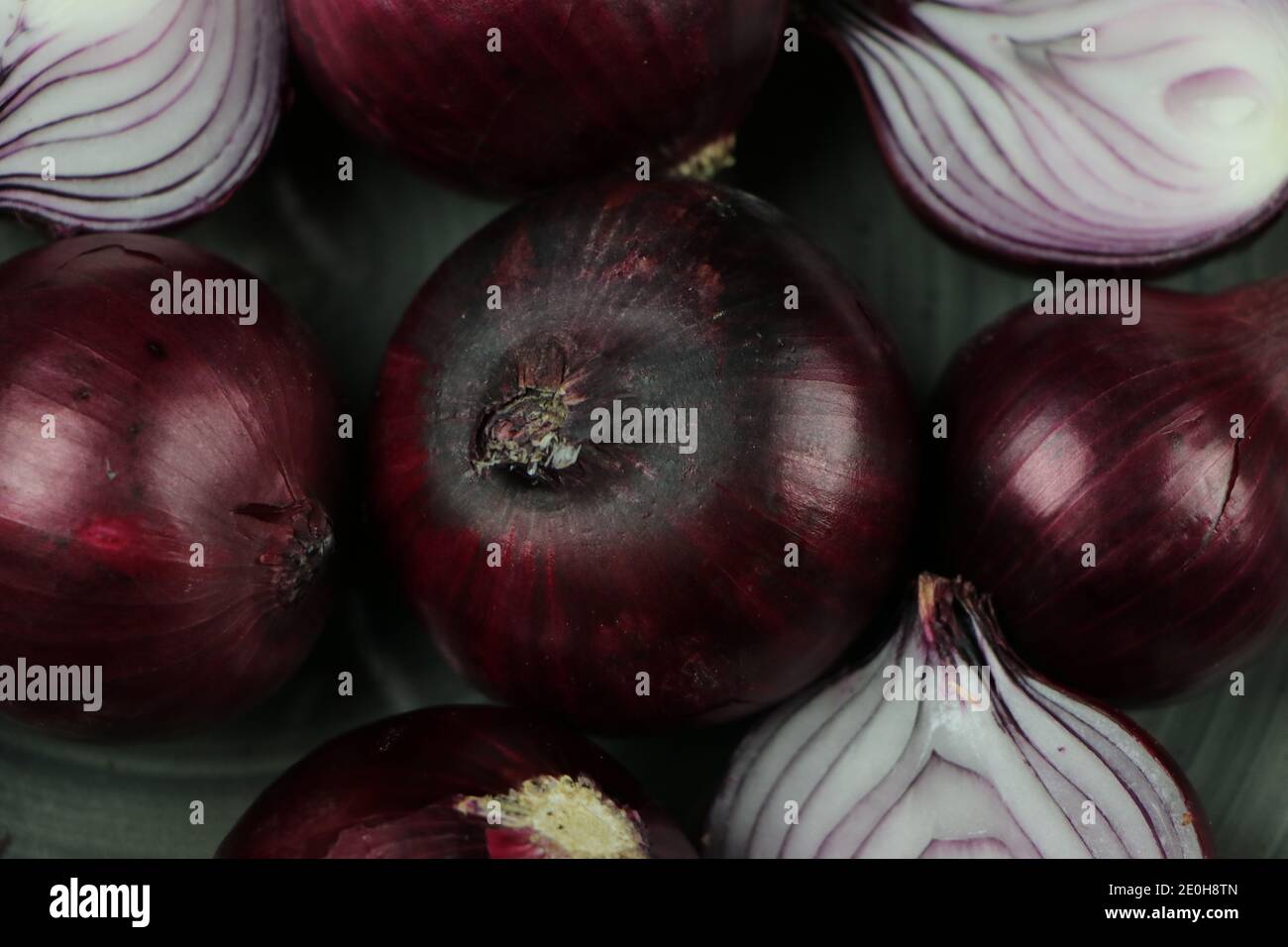 sweet red onions on background Stock Photo