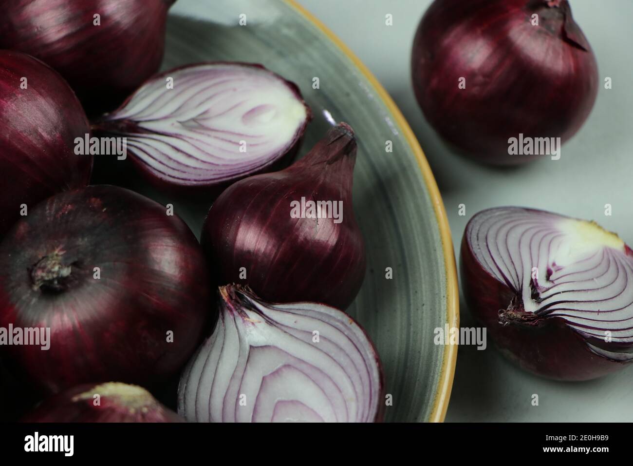 sweet red onions on background Stock Photo