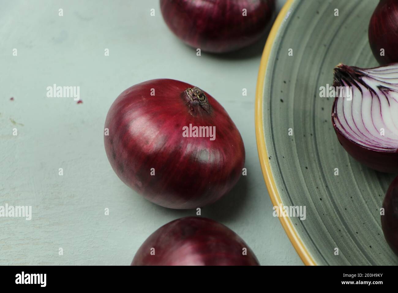sweet red onions on background Stock Photo