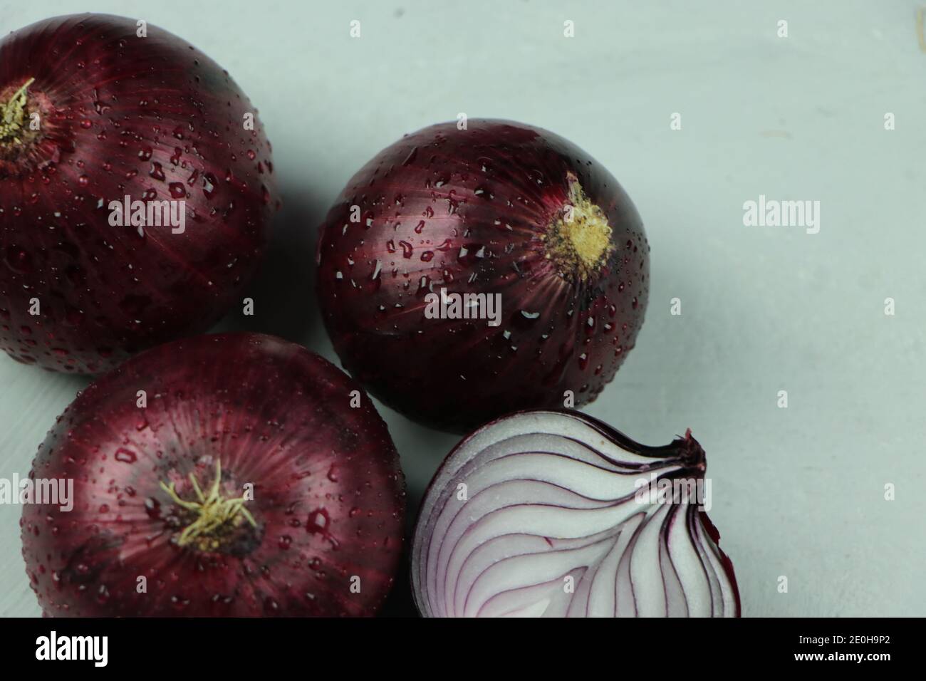 sweet red onions on background Stock Photo