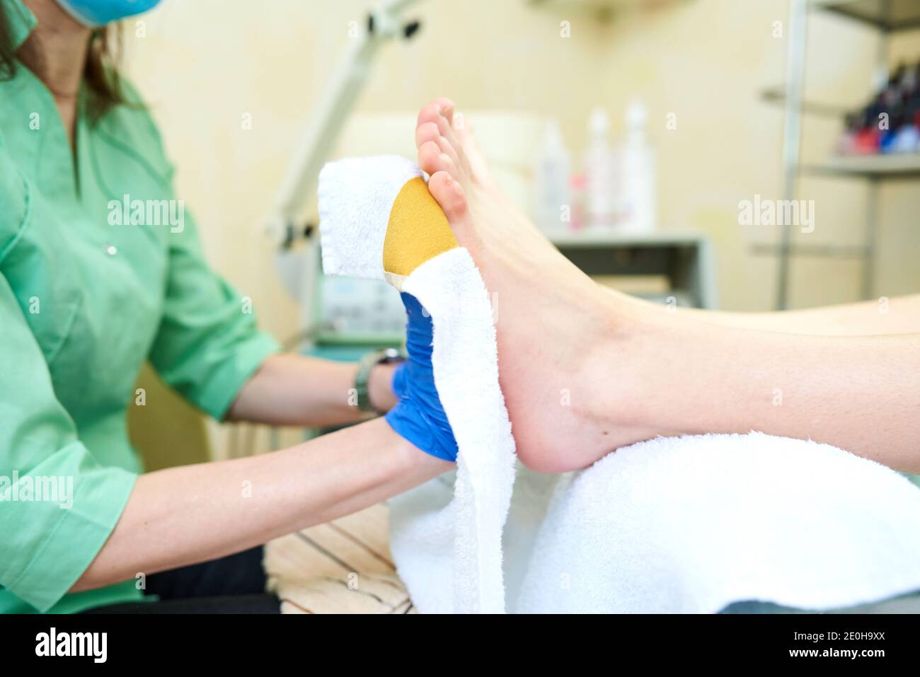 Woman getting a pedicure and relaxing at the beauty salon. Foot