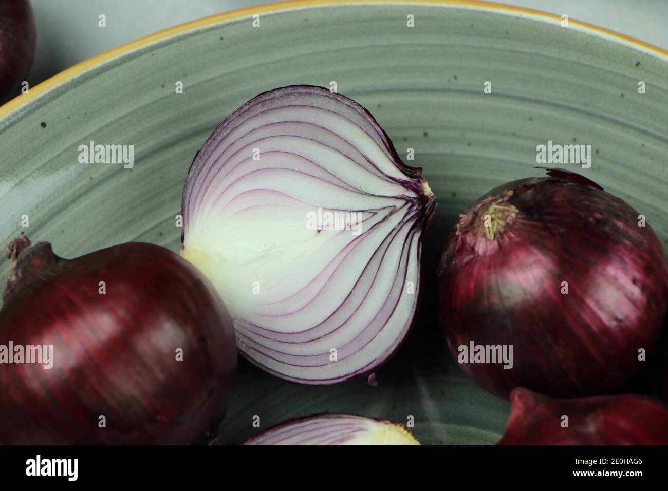 sweet red onions on background Stock Photo