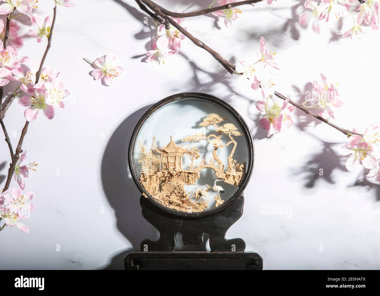 Japanese diorama of crane and bridge with cherry blossoms Stock Photo