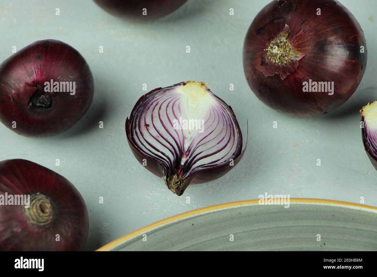 sweet red onions on background Stock Photo