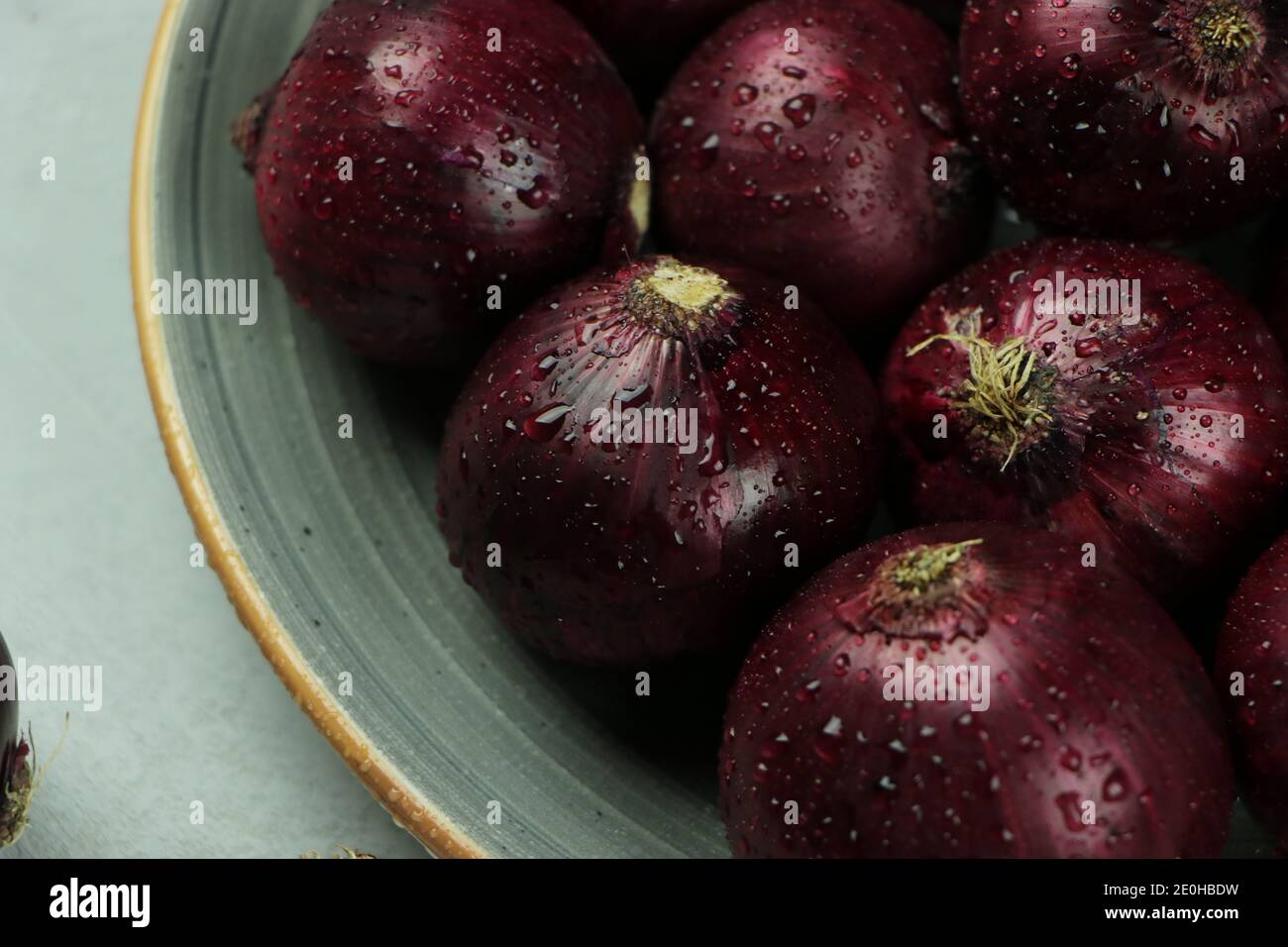 sweet red onions on background Stock Photo