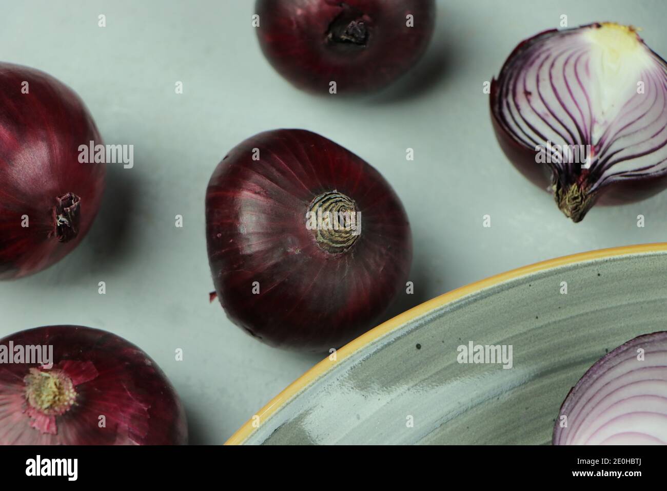 sweet red onions on background Stock Photo