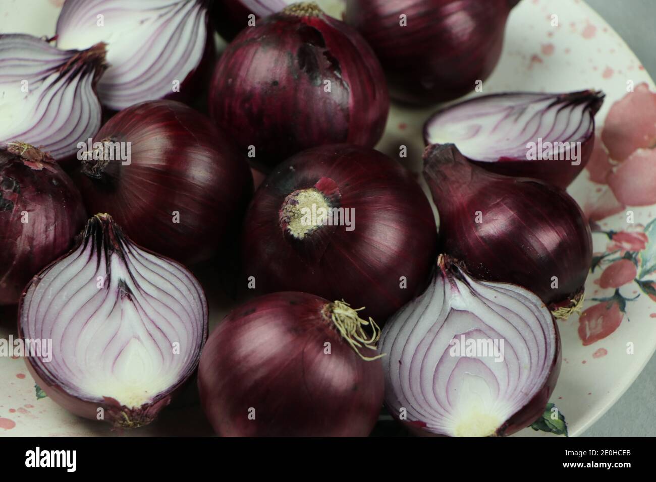 sweet red onions on background Stock Photo