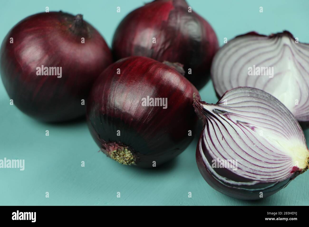 sweet red onions on background Stock Photo
